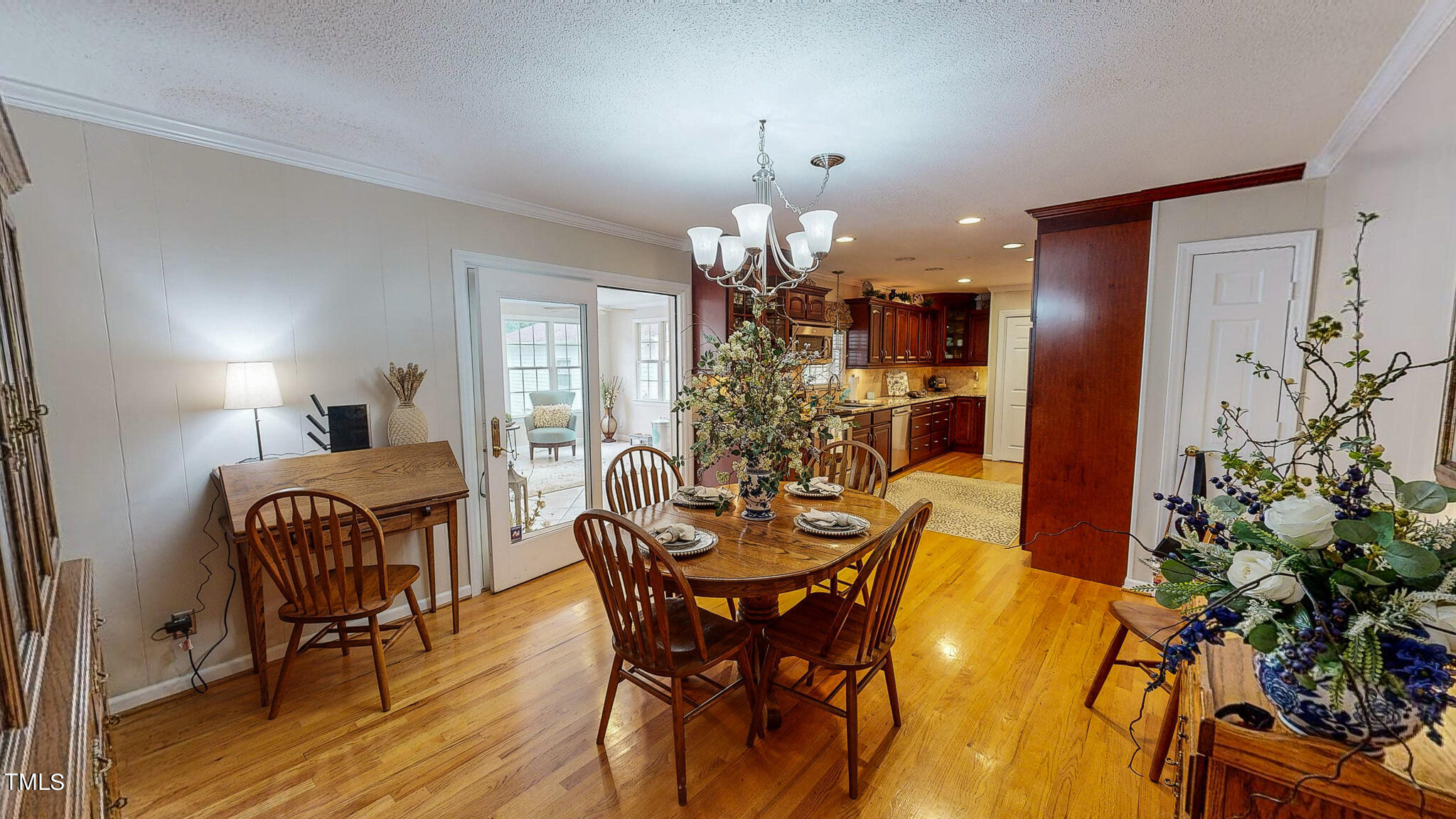 1804 Grady Drive Durham, NC 27712 - Photo 10 of 43 a view of a dining room with furniture and chandelier