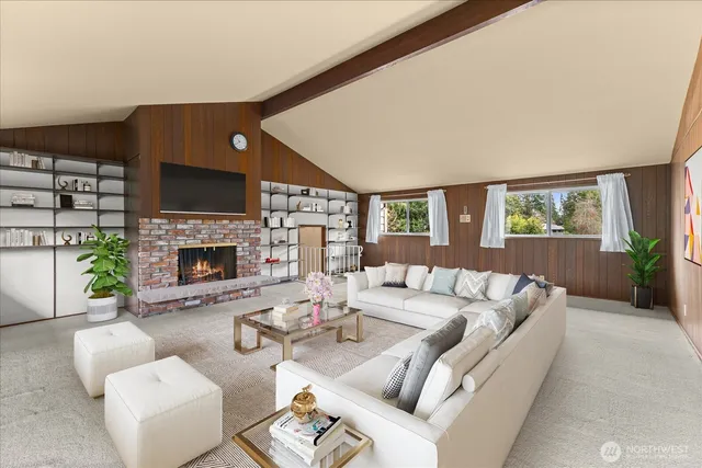 a living room with furniture a fireplace and a window