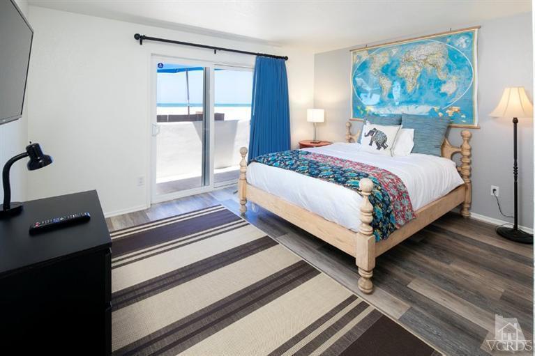 4025 Ocean Drive Oxnard, CA 93035 - Photo 16 of 31 a bedroom with a bed and a window