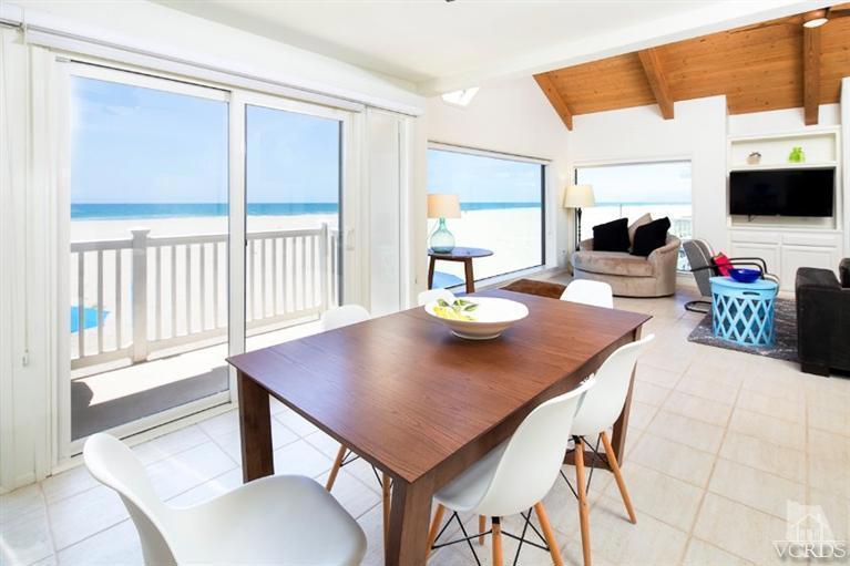 4025 Ocean Drive Oxnard, CA 93035 - Photo 21 of 31 a view of a dining room with a table and chairs