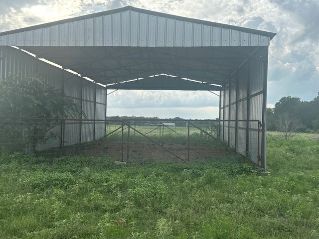 8616 Schuster Road Ledbetter, TX 78946 - Photo 7 of 10 a backyard of a house with lots of green space