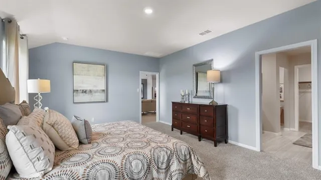 a bedroom with bed and a night stand