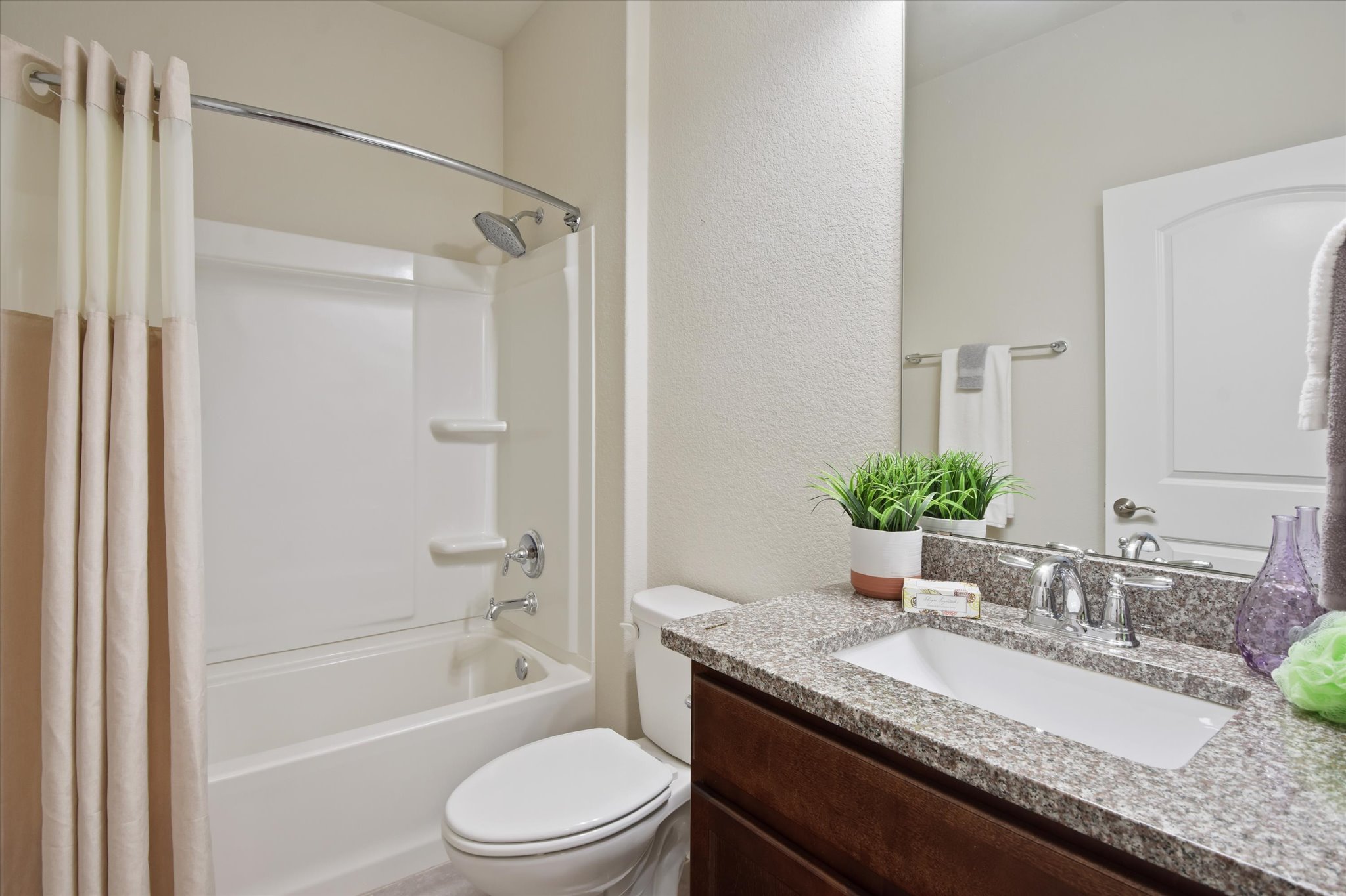 104 Coffee Mill Creek Road Georgetown, TX 78633 - Photo 29 of 40 Well appointed guest bathroom featuring granite countertops and a tub/shower combination.
