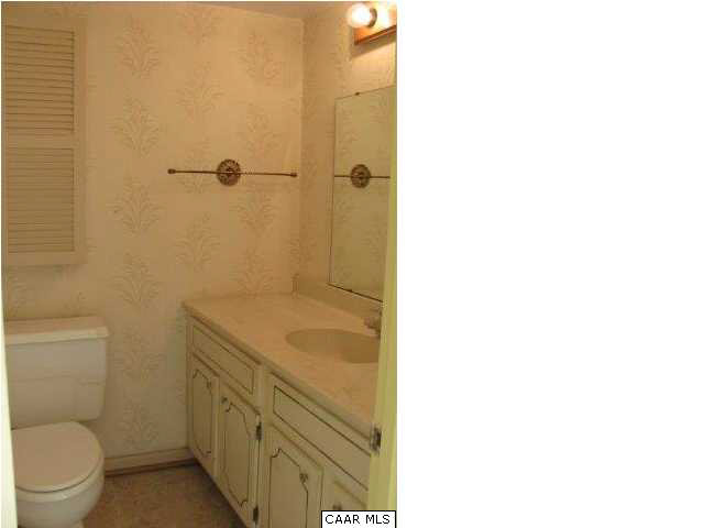 12 Spring Court Charlottesville, VA 22901 - Photo 20 of 25 a bathroom with a granite countertop toilet and a sink