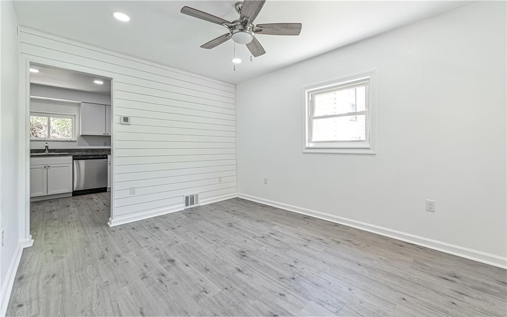 46 Winchell Street Pittsburgh, PA 15215 - Photo 4 of 18 Shiplap wall in living room. Entire house has been freshly painted with new low maintenance wood look flooring on main level.