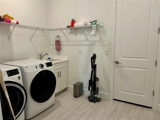 a view of tennis court with yard