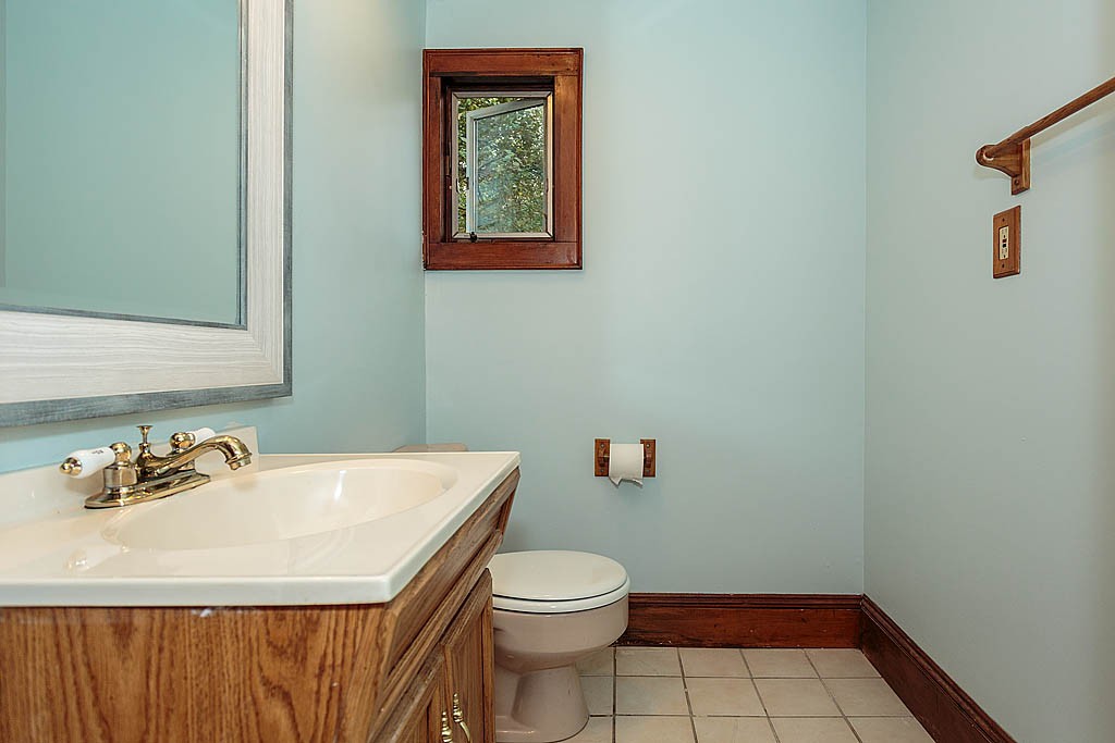 32 Harding Street Chelmsford, MA 01863 - Photo 8 of 30 a bathroom with a sink a toilet and a mirror
