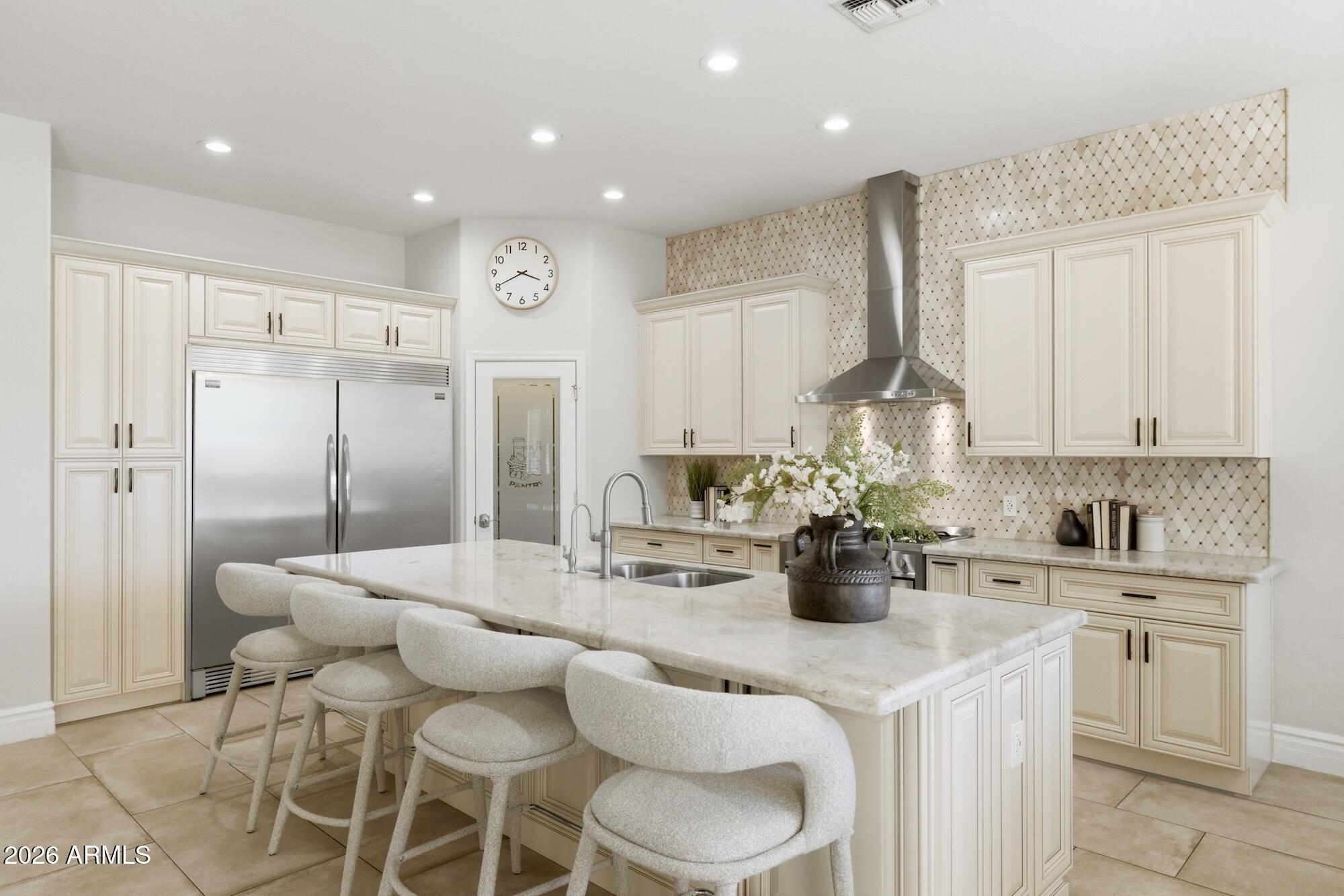 a kitchen with stainless steel appliances kitchen island granite countertop a sink and cabinets