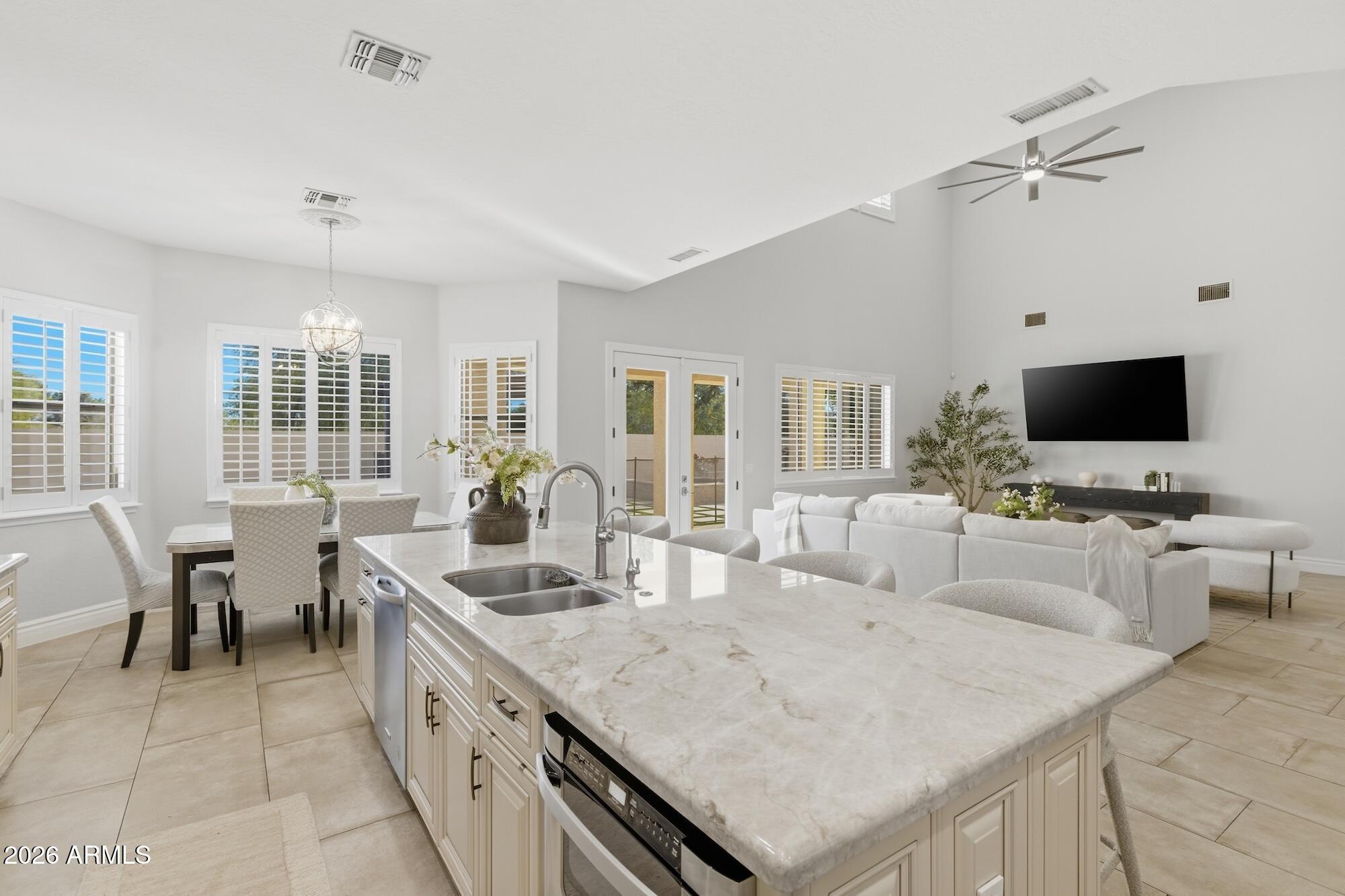 3425 East Mockingbird Drive Gilbert, AZ 85234 - Photo 18 of 52 a large white kitchen with a large window