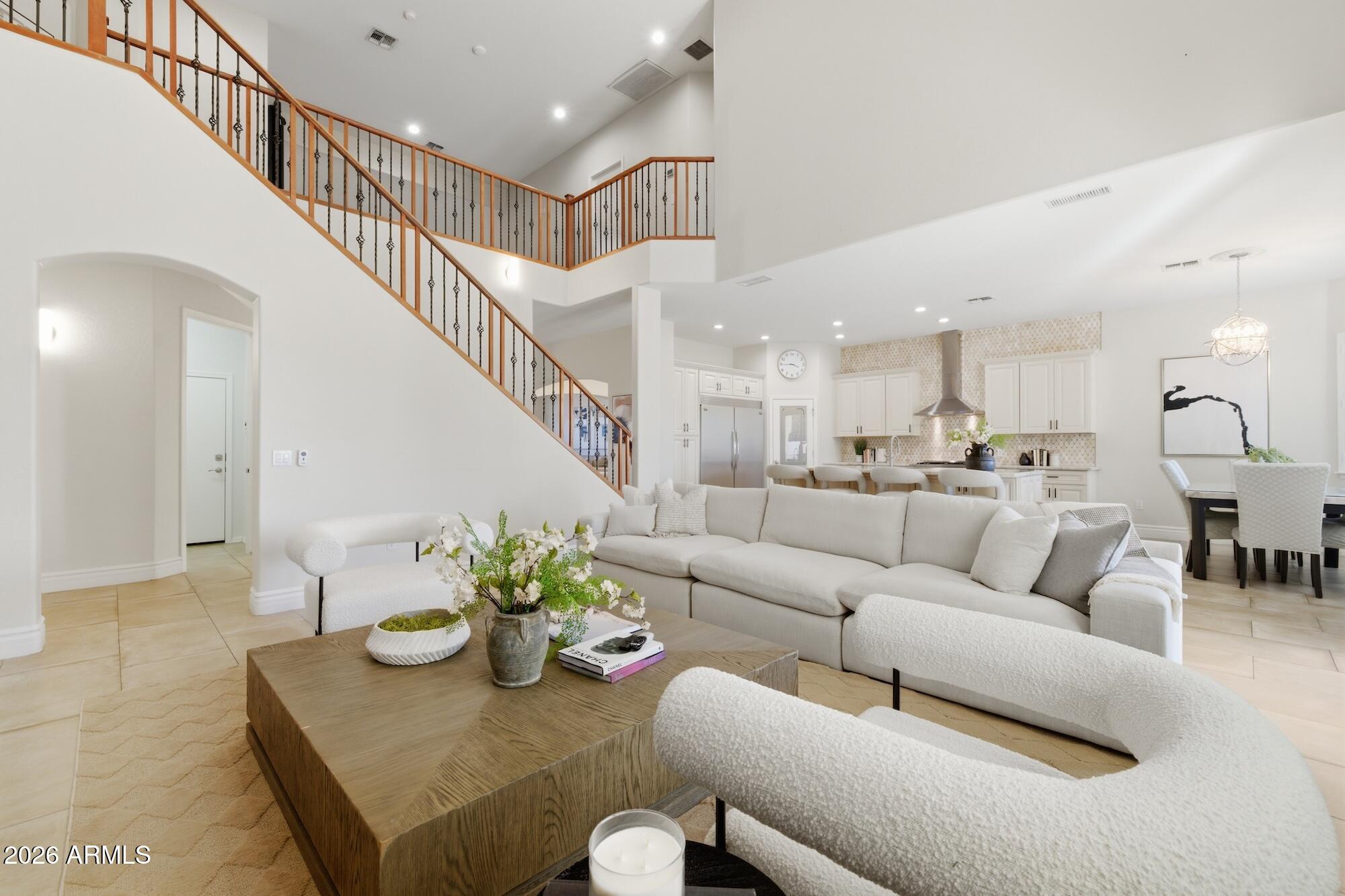 3425 East Mockingbird Drive Gilbert, AZ 85234 - Photo 21 of 52 a living room with furniture kitchen view and a dining table
