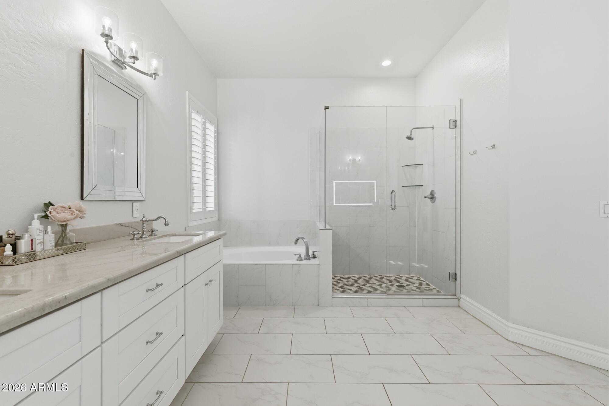 3425 East Mockingbird Drive Gilbert, AZ 85234 - Photo 25 of 52 a bathroom with a granite countertop sink a toilet a mirror and shower