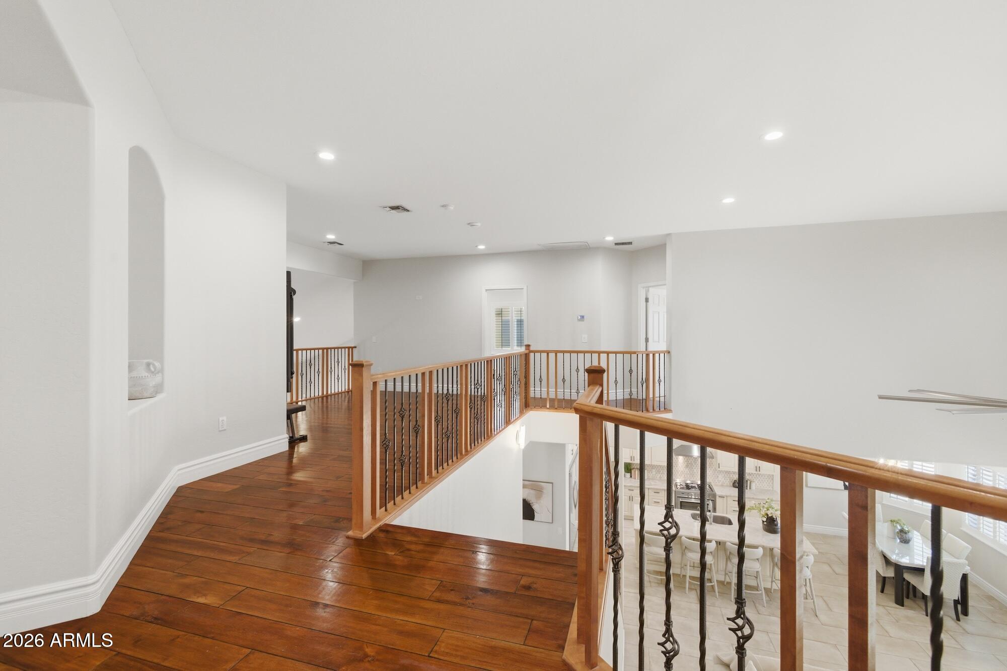 3425 East Mockingbird Drive Gilbert, AZ 85234 - Photo 27 of 52 a view of a hallway with wooden floor