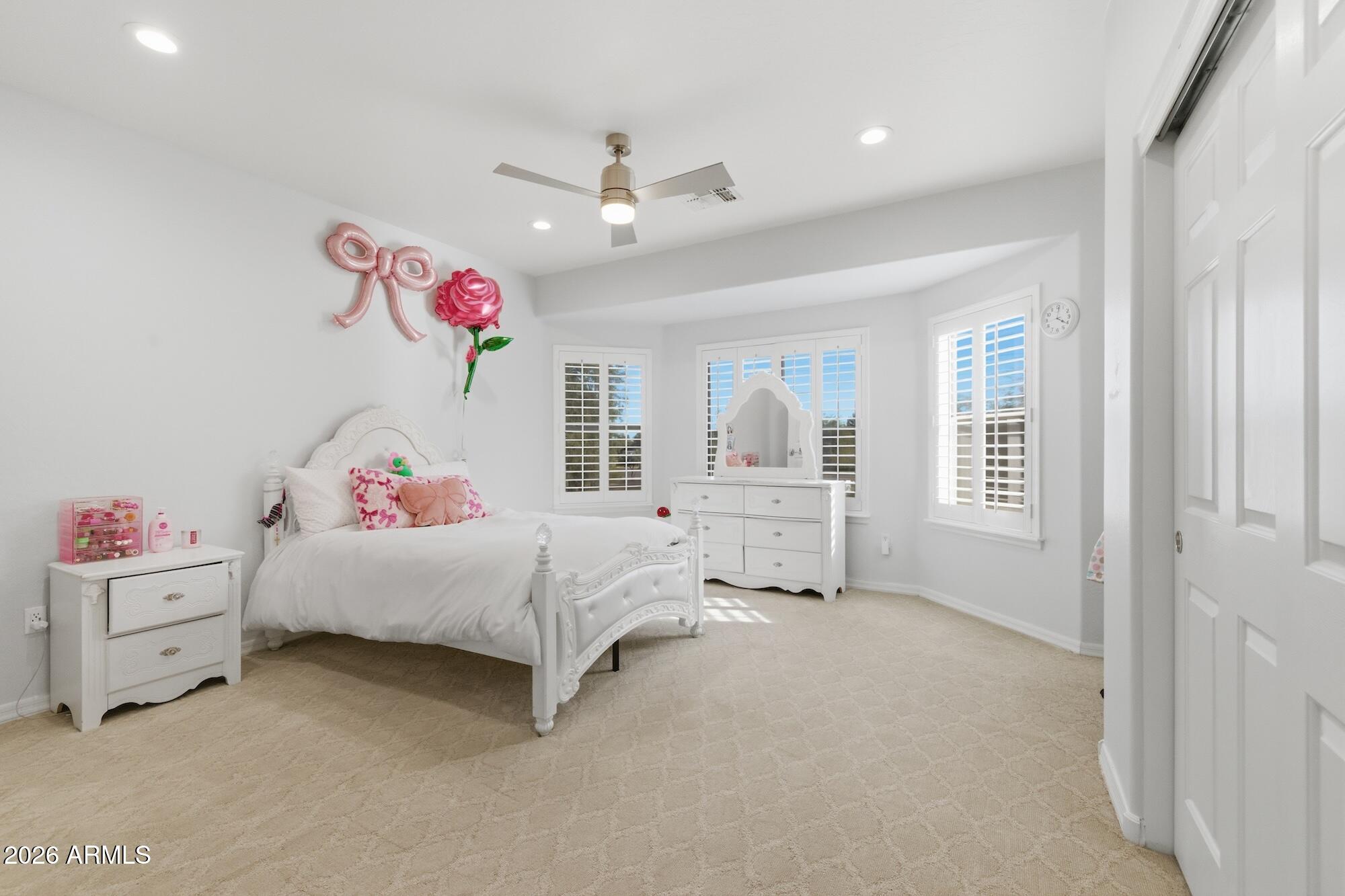 3425 East Mockingbird Drive Gilbert, AZ 85234 - Photo 28 of 52 a bedroom with a bed and a chandelier