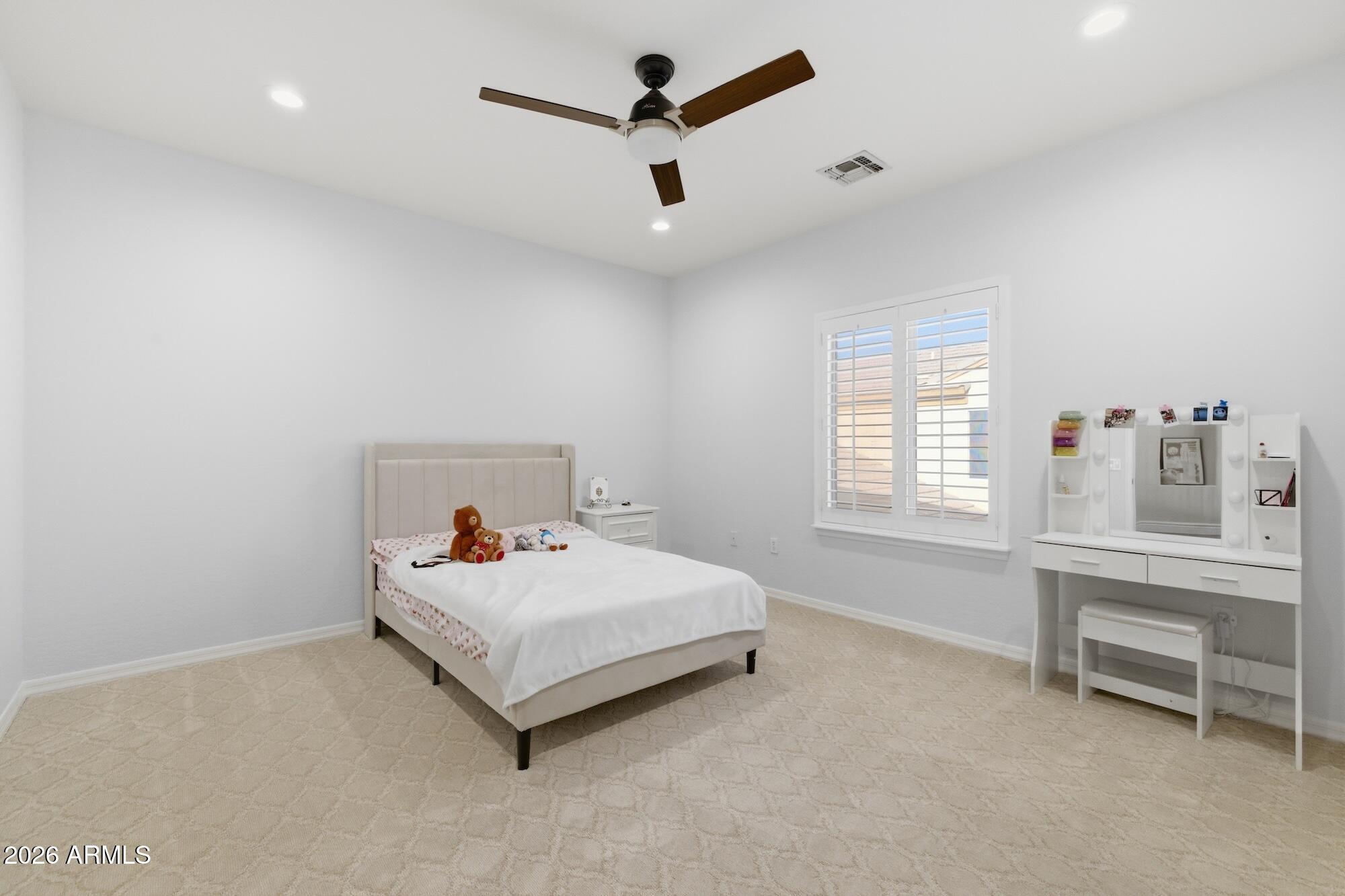 3425 East Mockingbird Drive Gilbert, AZ 85234 - Photo 30 of 52 a bed room with a bed and a window