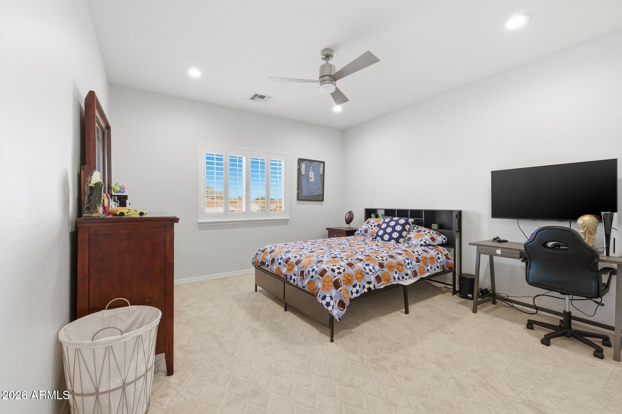 3425 East Mockingbird Drive Gilbert, AZ 85234 - Photo 34 of 52 a bedroom with a bed and furniture