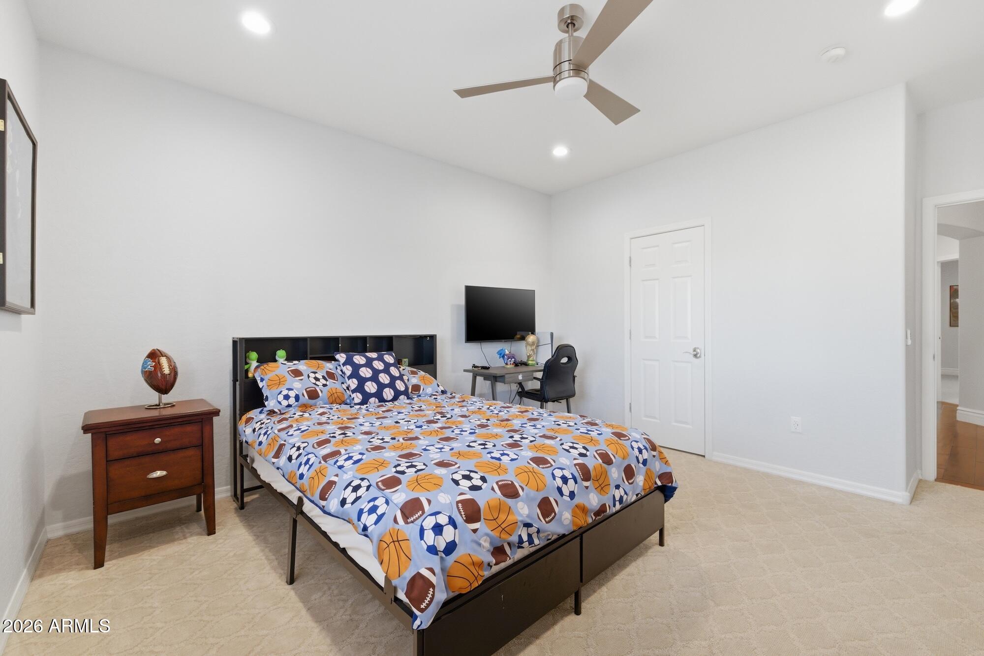 3425 East Mockingbird Drive Gilbert, AZ 85234 - Photo 35 of 52 a bedroom with a bed and a flat screen tv