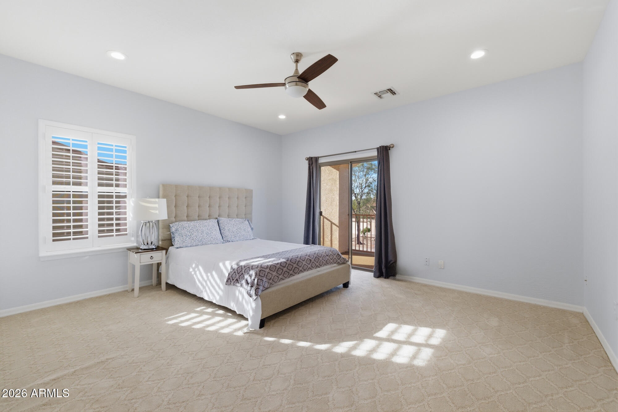 3425 East Mockingbird Drive Gilbert, AZ 85234 - Photo 36 of 52 a spacious bedroom with a bed and a window