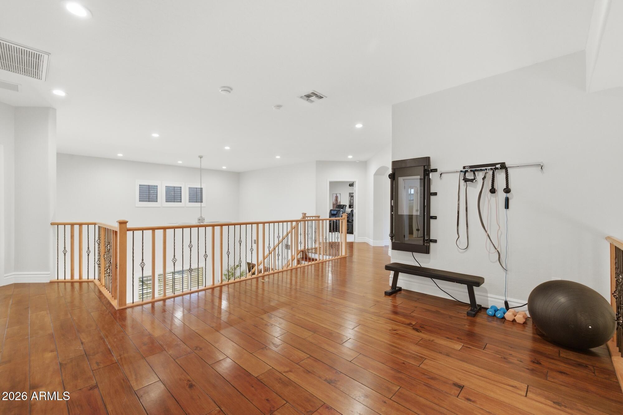 3425 East Mockingbird Drive Gilbert, AZ 85234 - Photo 39 of 52 a view of livingroom with wooden floor and windows