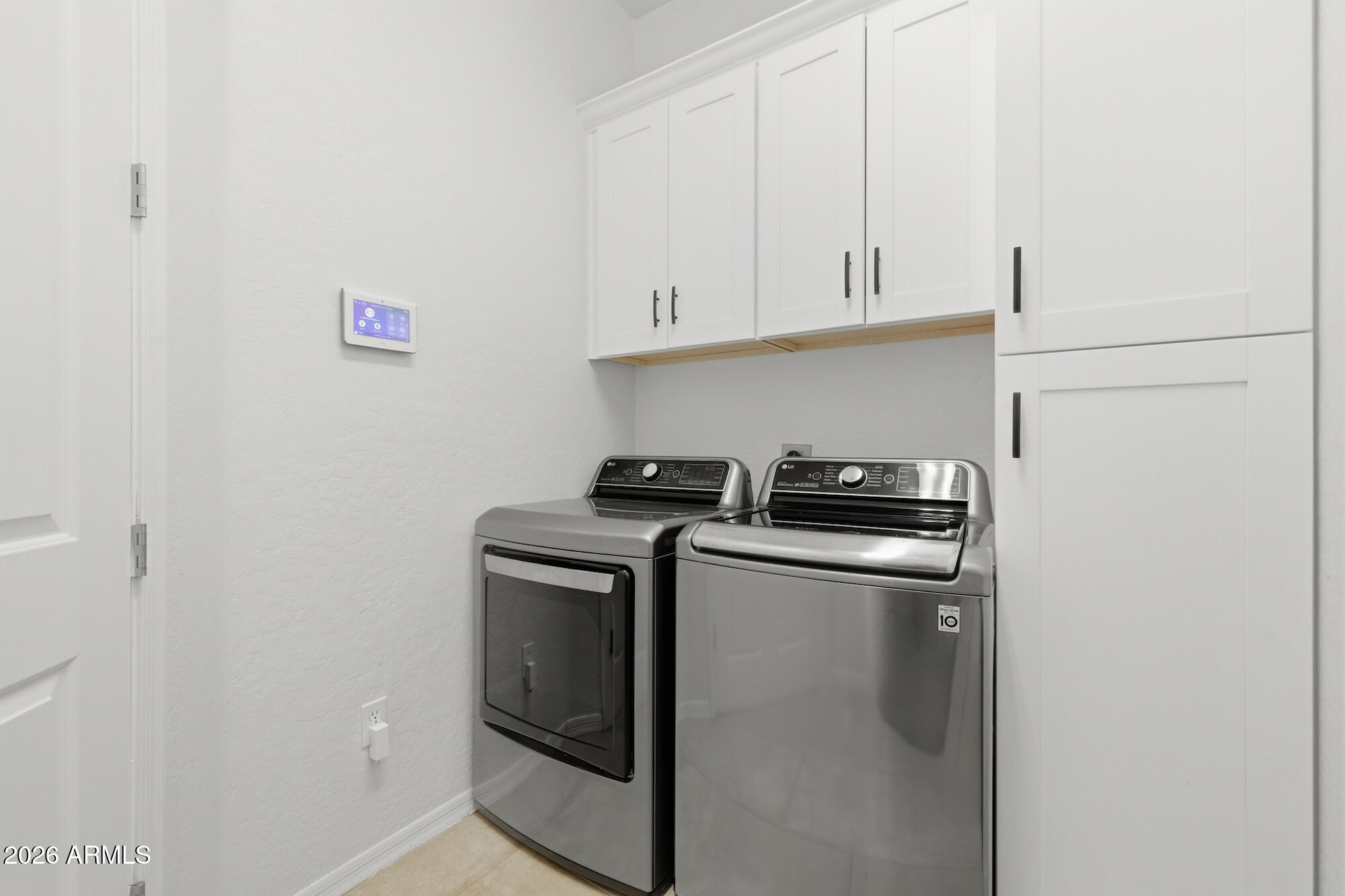 3425 East Mockingbird Drive Gilbert, AZ 85234 - Photo 41 of 52 a view of storage and utility room with washer and dryer