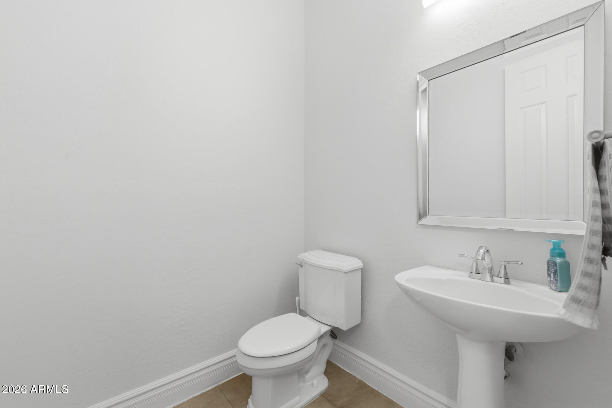 3425 East Mockingbird Drive Gilbert, AZ 85234 - Photo 42 of 52 a bathroom with a sink toilet and a mirror