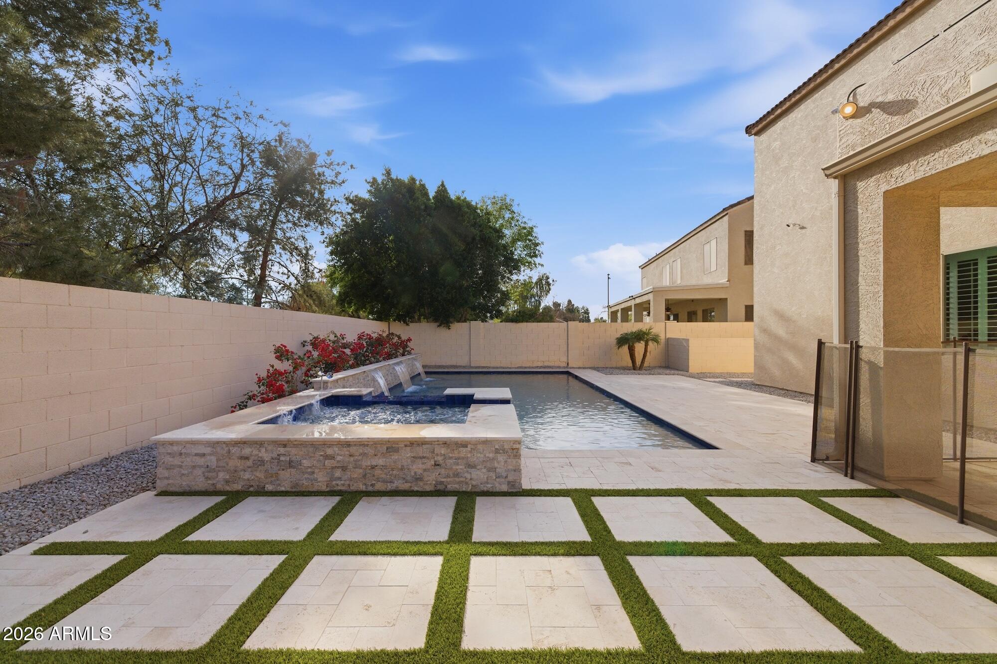 3425 East Mockingbird Drive Gilbert, AZ 85234 - Photo 45 of 52 a view of a balcony with furniture and a potted plant