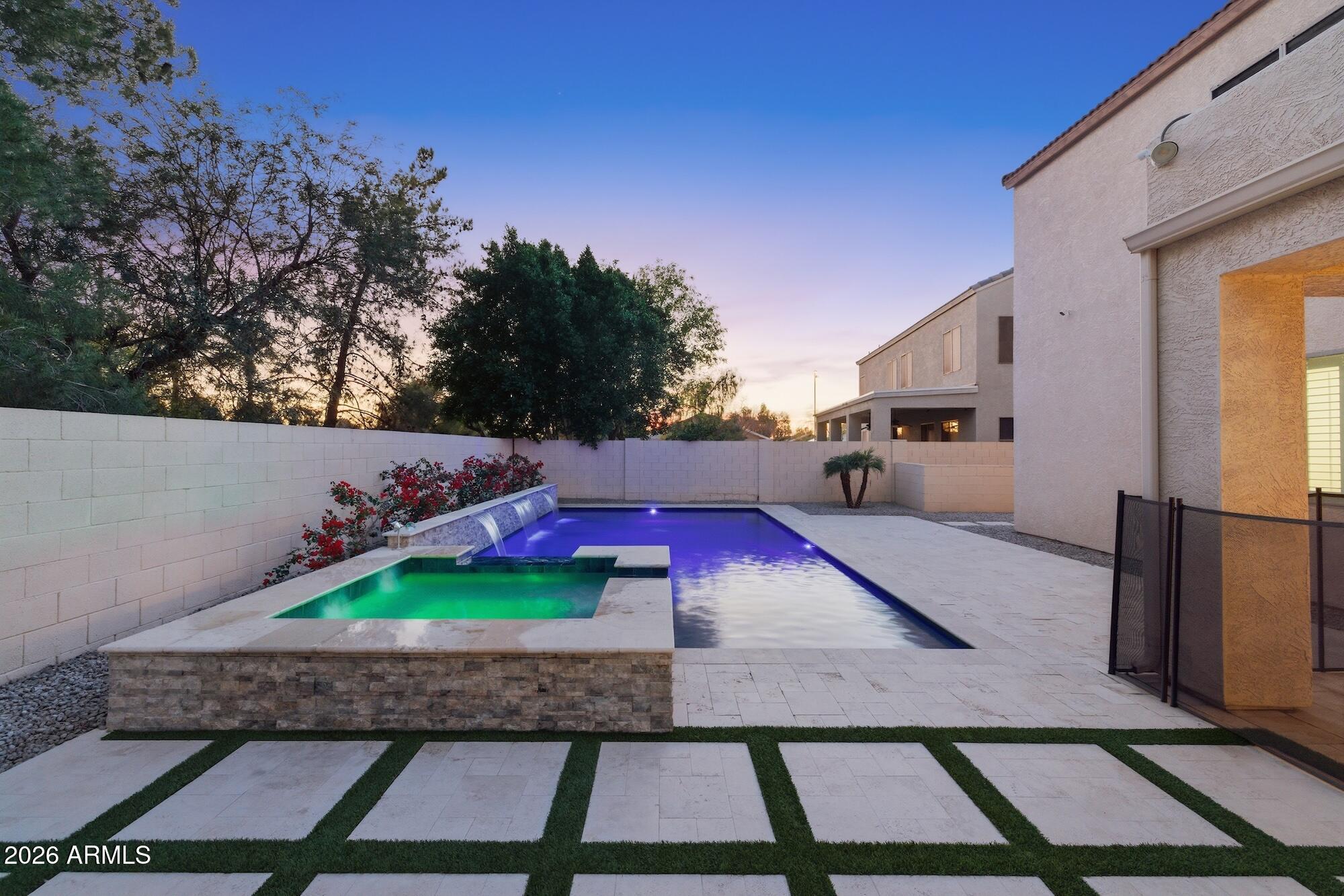 3425 East Mockingbird Drive Gilbert, AZ 85234 - Photo 46 of 52 a view of a backyard with dishwasher and outdoor kitchen
