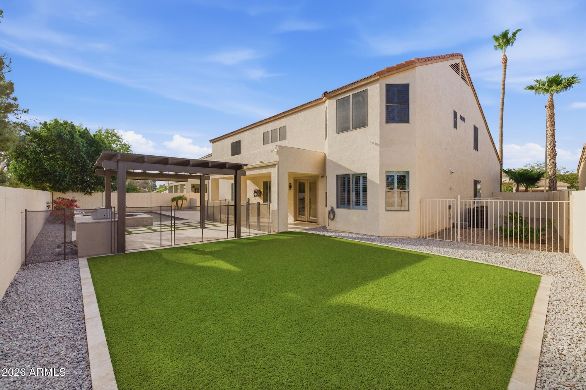 3425 East Mockingbird Drive Gilbert, AZ 85234 - Photo 47 of 52 a view of a house with backyard and porch