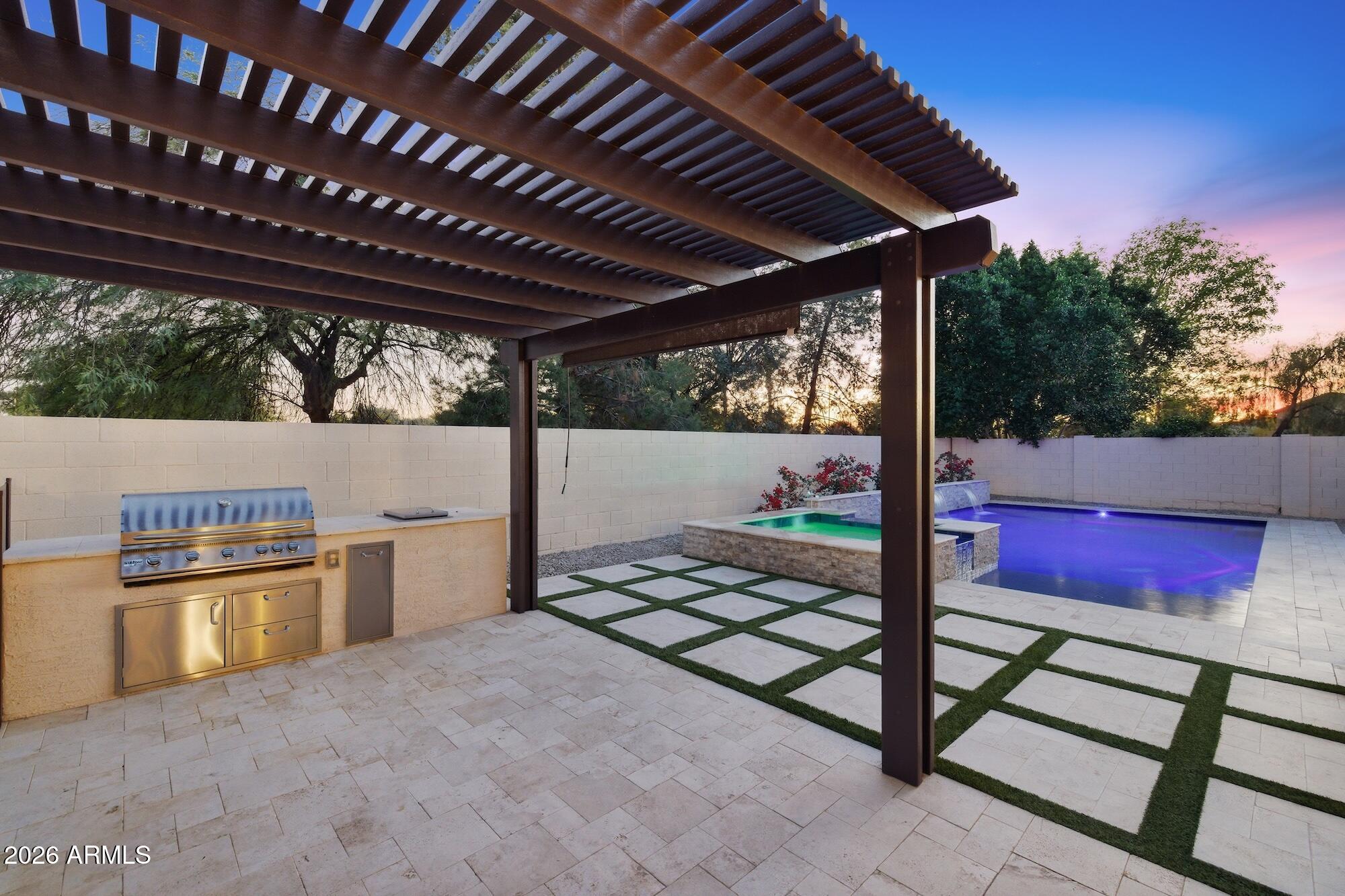 3425 East Mockingbird Drive Gilbert, AZ 85234 - Photo 6 of 52 a view of a porch with furniture and a yard