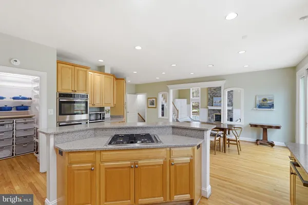 a kitchen with counter top space cabinets and appliances