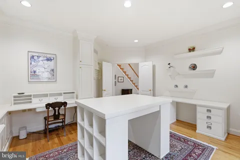 a living room with furniture a rug and a large window