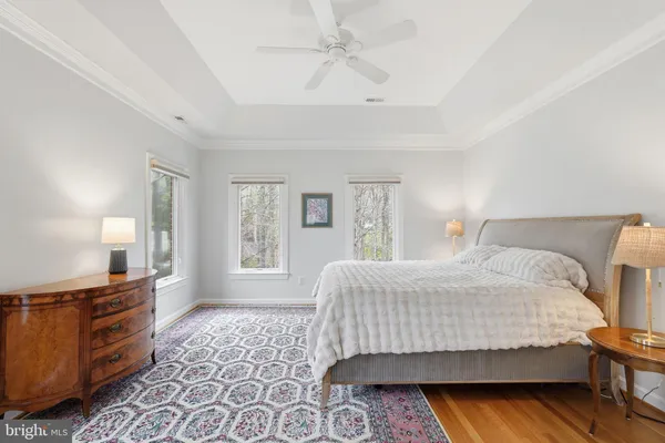 a spacious bedroom with a bed and a fireplace