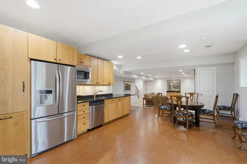 a view of a house with swimming pool and sitting area