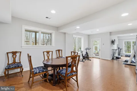 a view of a patio with table and chairs and potted plants