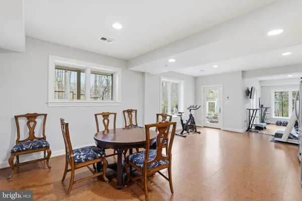 a view of a patio with table and chairs and potted plants