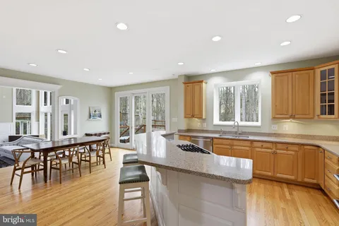 a large kitchen with lots of counter space and furniture