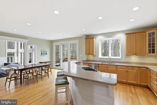 a large kitchen with lots of counter space and furniture
