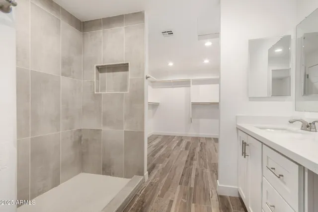 a view of a room with wooden floor