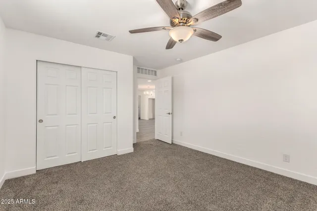 a bathroom with a sink toilet vanity and tub