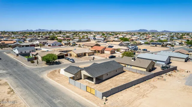 an aerial view of residential houses with outdoor space