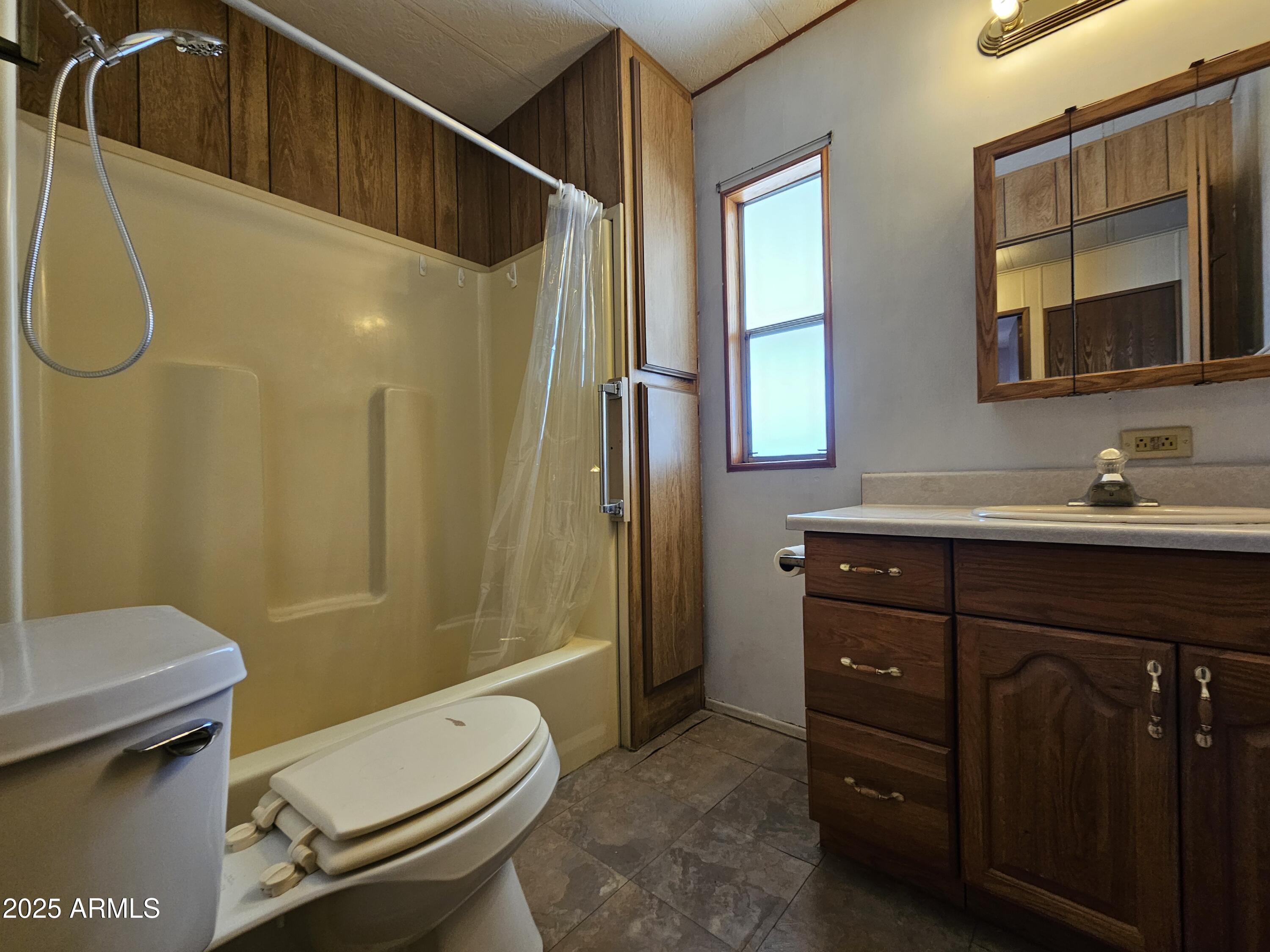 200 East Ivanhoe Street, Unit 60 Chandler, AZ 85225 - Photo 5 of 10 a bathroom with a sink vanity mirror and toilet