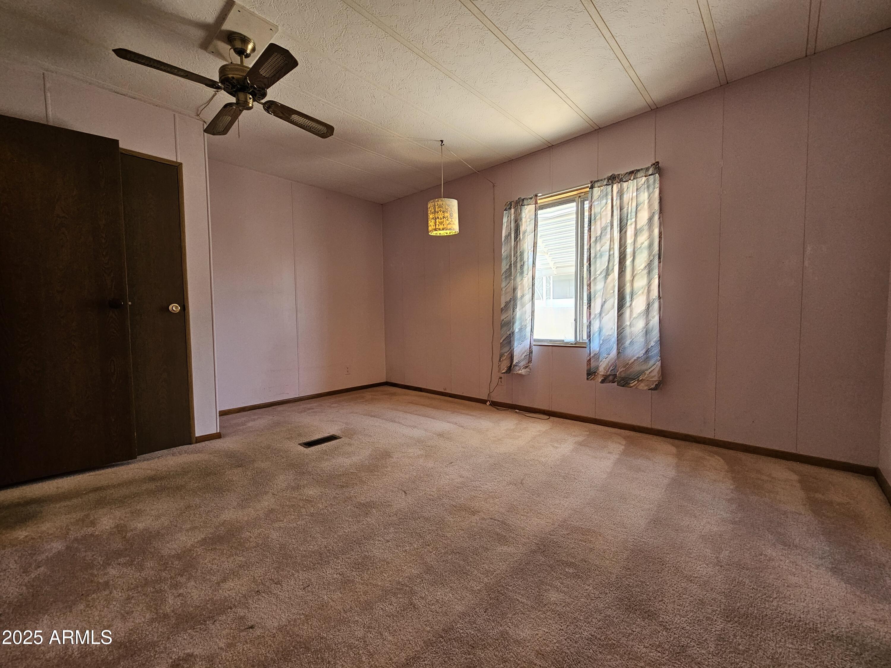 200 East Ivanhoe Street, Unit 60 Chandler, AZ 85225 - Photo 6 of 10 a view of an empty room with a window