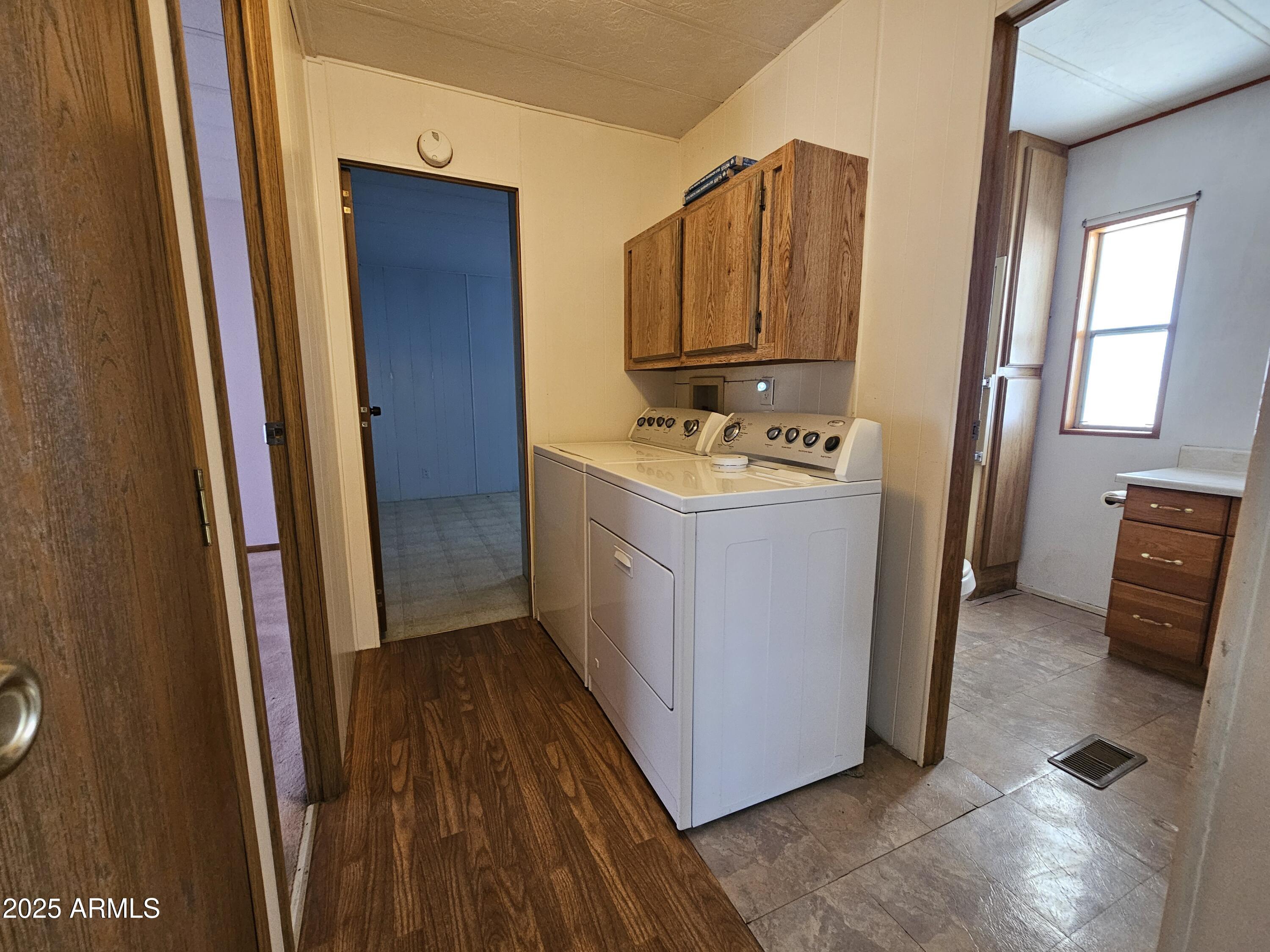 200 East Ivanhoe Street, Unit 60 Chandler, AZ 85225 - Photo 9 of 10 a bathroom with a sink a mirror and a toilet