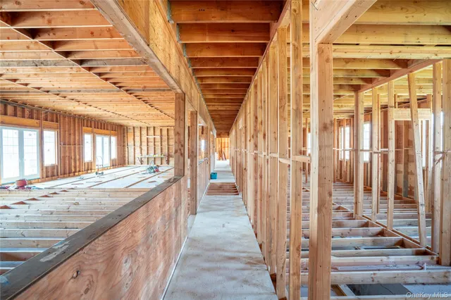 a view of a parking space with a patio