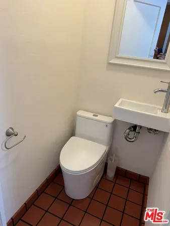 a bathroom with a sink and a toilet