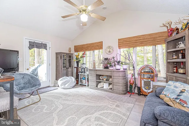 a bedroom with furniture and a window