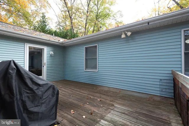 a view of a two chairs in the balcony