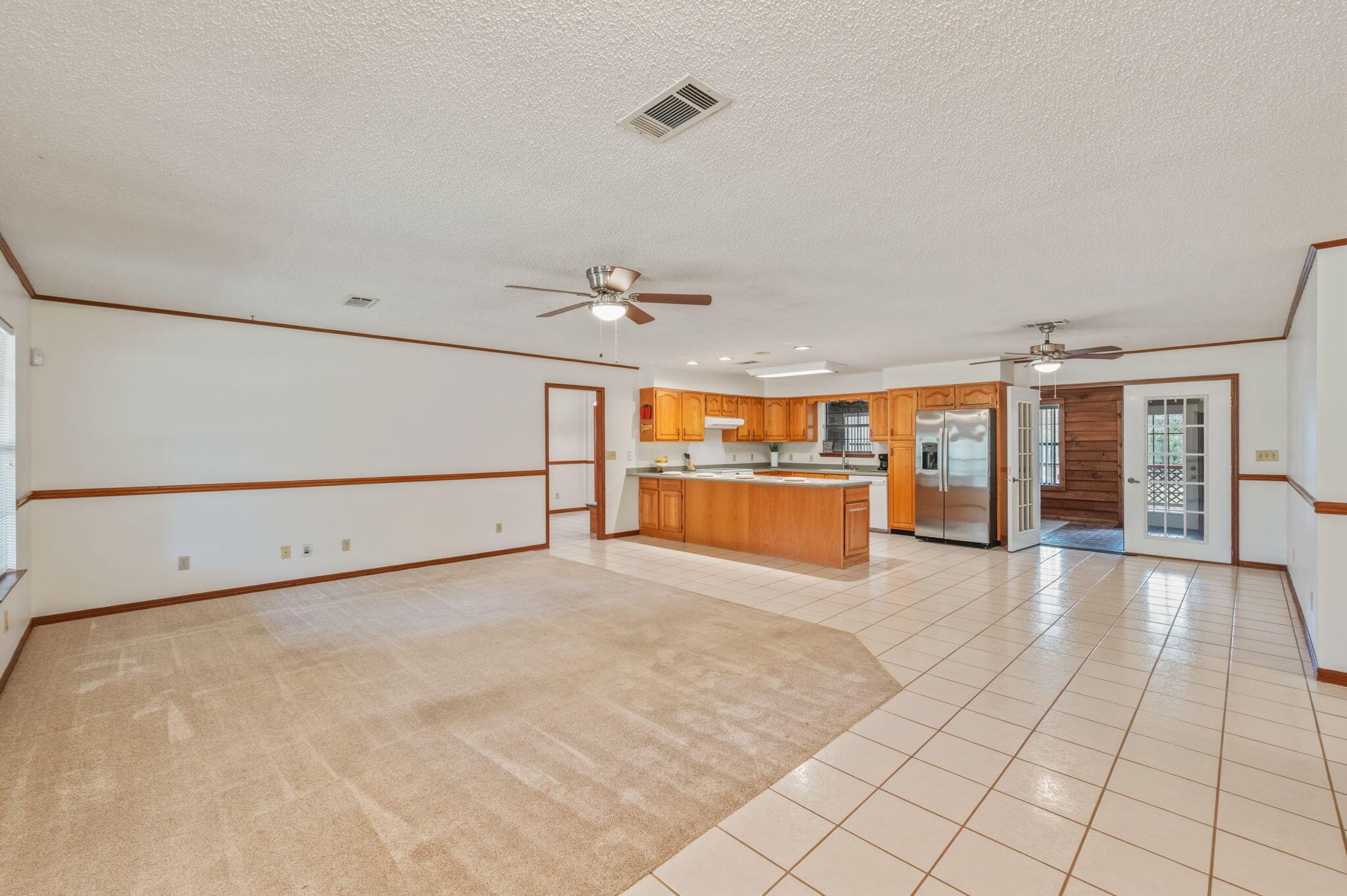 4841 Antioch Road Crestview, FL 32536 - Photo 11 of 70 a view of a livingroom with an empty space and a stove top oven