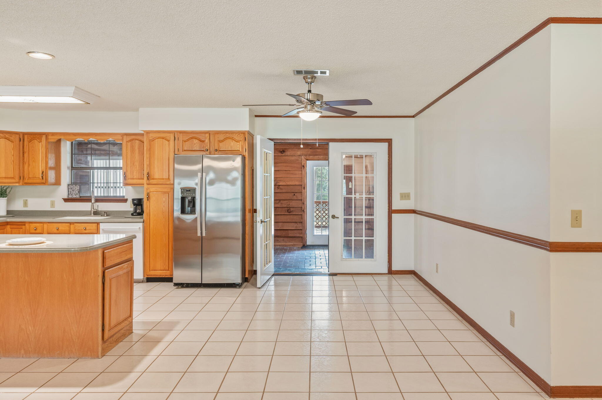 4841 Antioch Road Crestview, FL 32536 - Photo 15 of 70 a view of a kitchen with a sink and a refrigerator