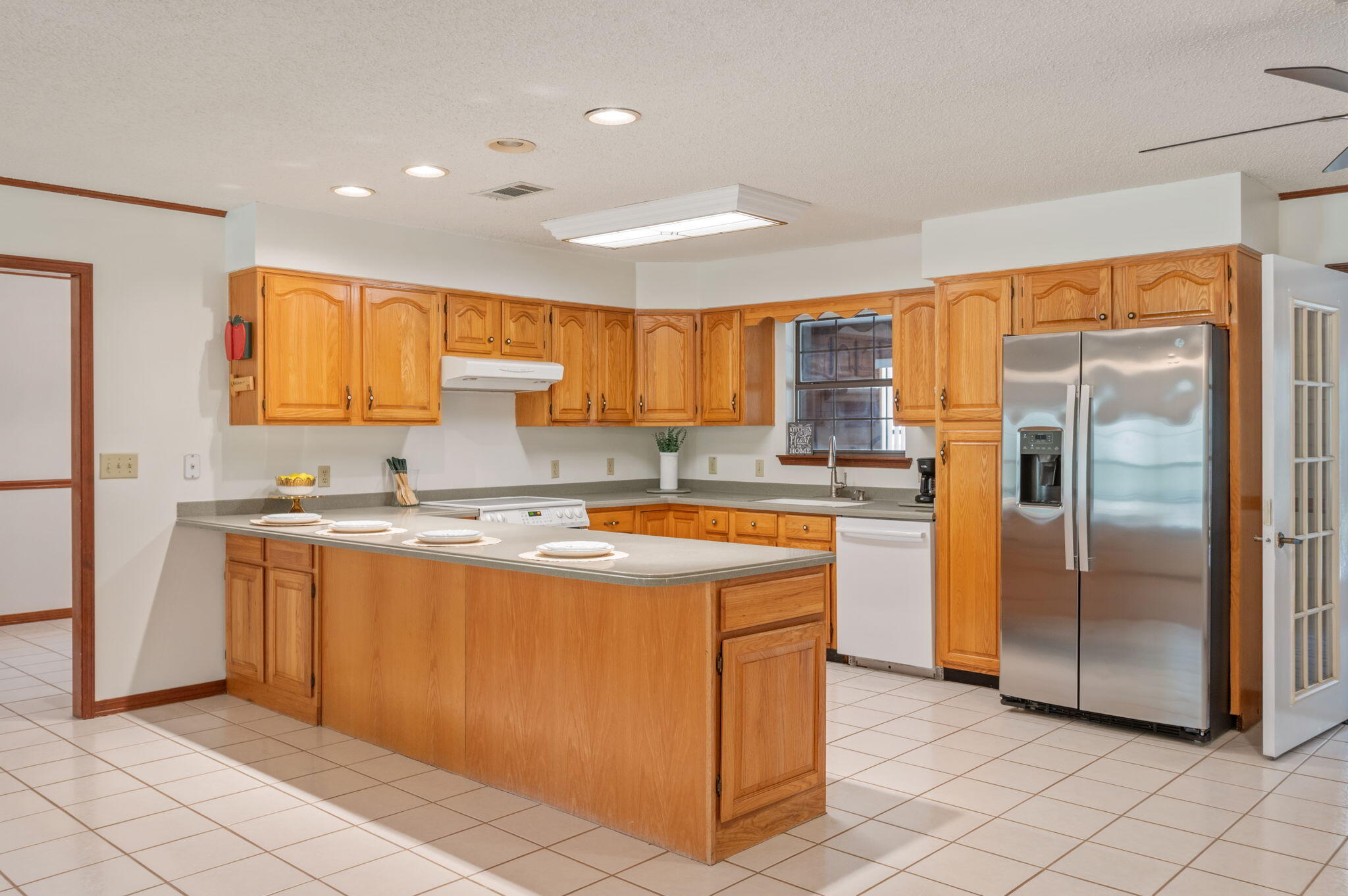 4841 Antioch Road Crestview, FL 32536 - Photo 16 of 70 a kitchen with stainless steel appliances granite countertop a refrigerator and a stove
