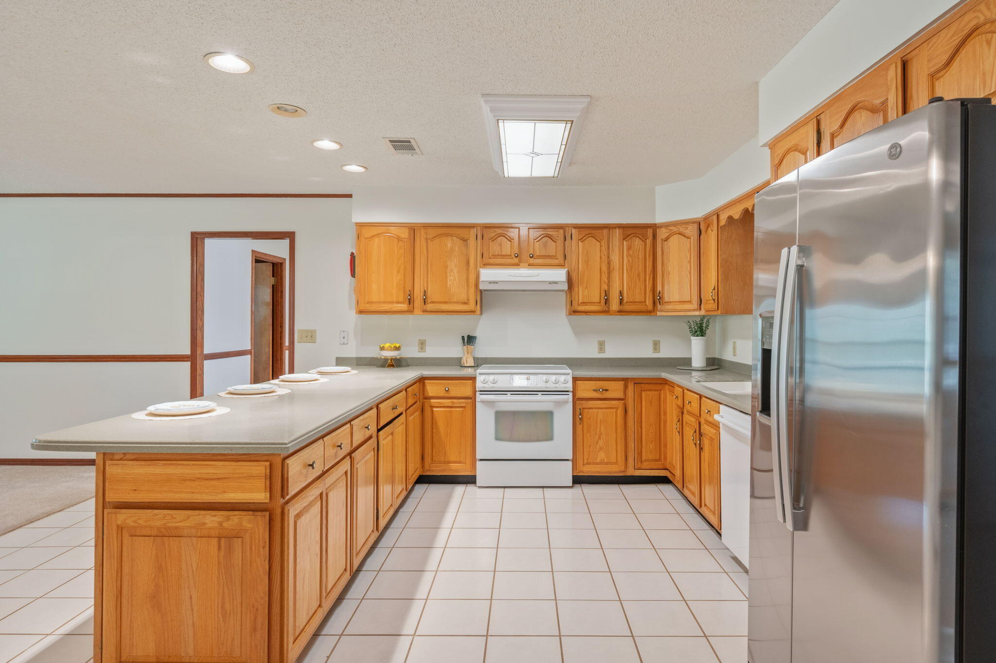 4841 Antioch Road Crestview, FL 32536 - Photo 17 of 70 a kitchen with stainless steel appliances granite countertop a sink stove and refrigerator